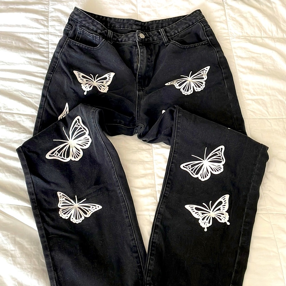 Black denim jeans with butterflies